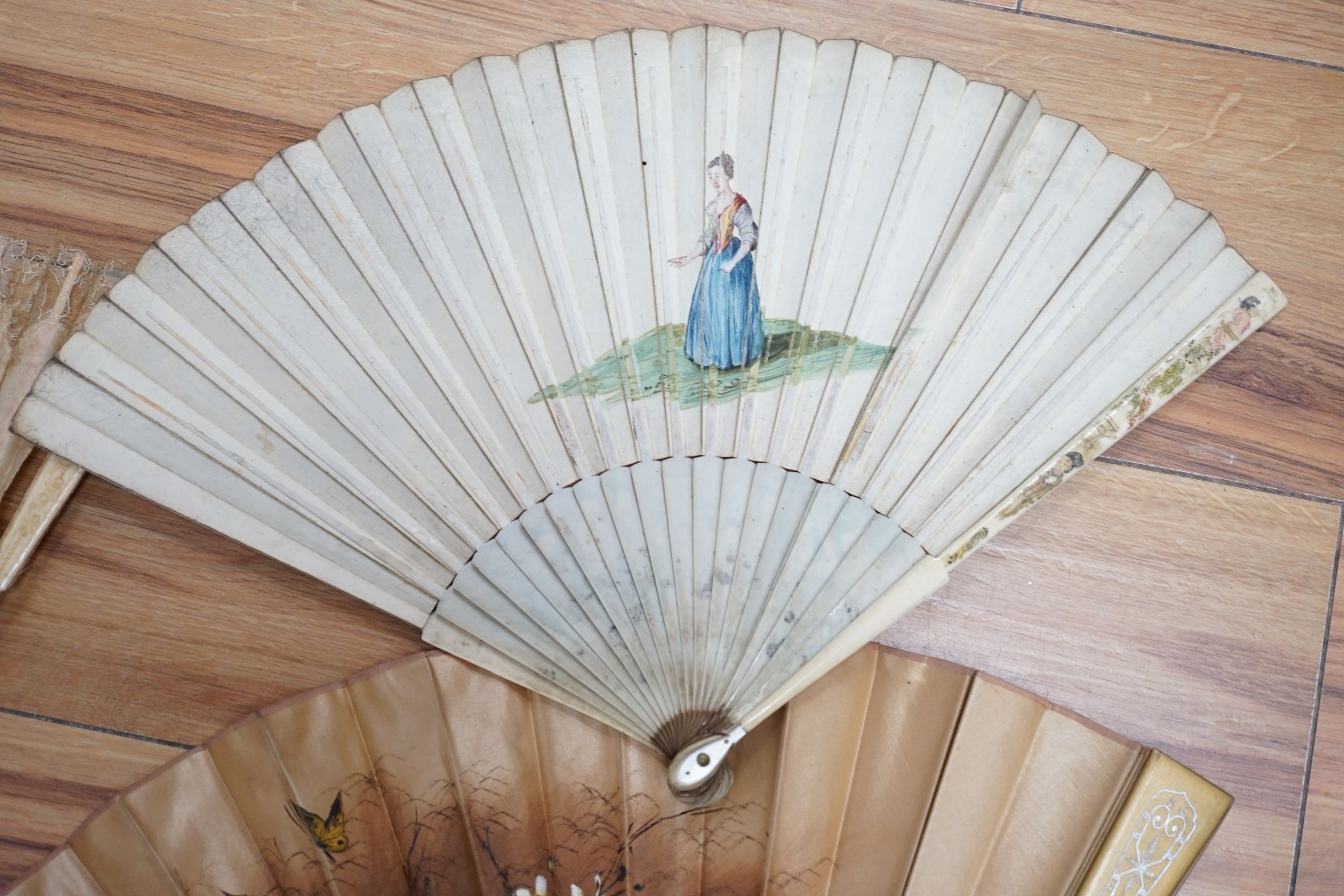 Five various fans, and an 18th century painted leaf fan with ivory chinoiserie decorated guards and sticks, 28 cms high (6)